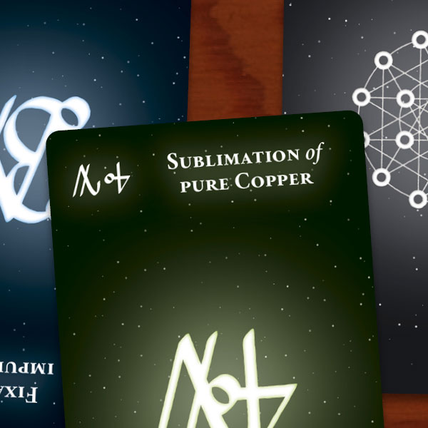 On a wooden surface, five tarot-sized cards are arranged a little unevenly, slightly overlapping. Each shows a combined alchemical sigil in the center. Above and below four of the symbols, the alchemical processes represented are written in white type; all of this appears to glows slightly. All cards show a dark, starry background, and each is tinted to reflect the element involved.
